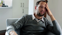 sad-unhappy-young-handsome-man-sitting-in-armchair-at-home_vjvyyqvql_thumbnail-1080_01.png